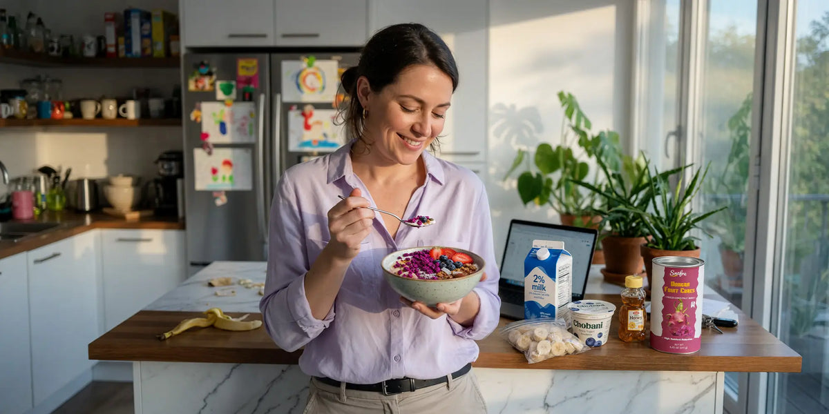 Woman preparing healthy fruit smoothie bowl at home with SNAFRE fruit crumbles
